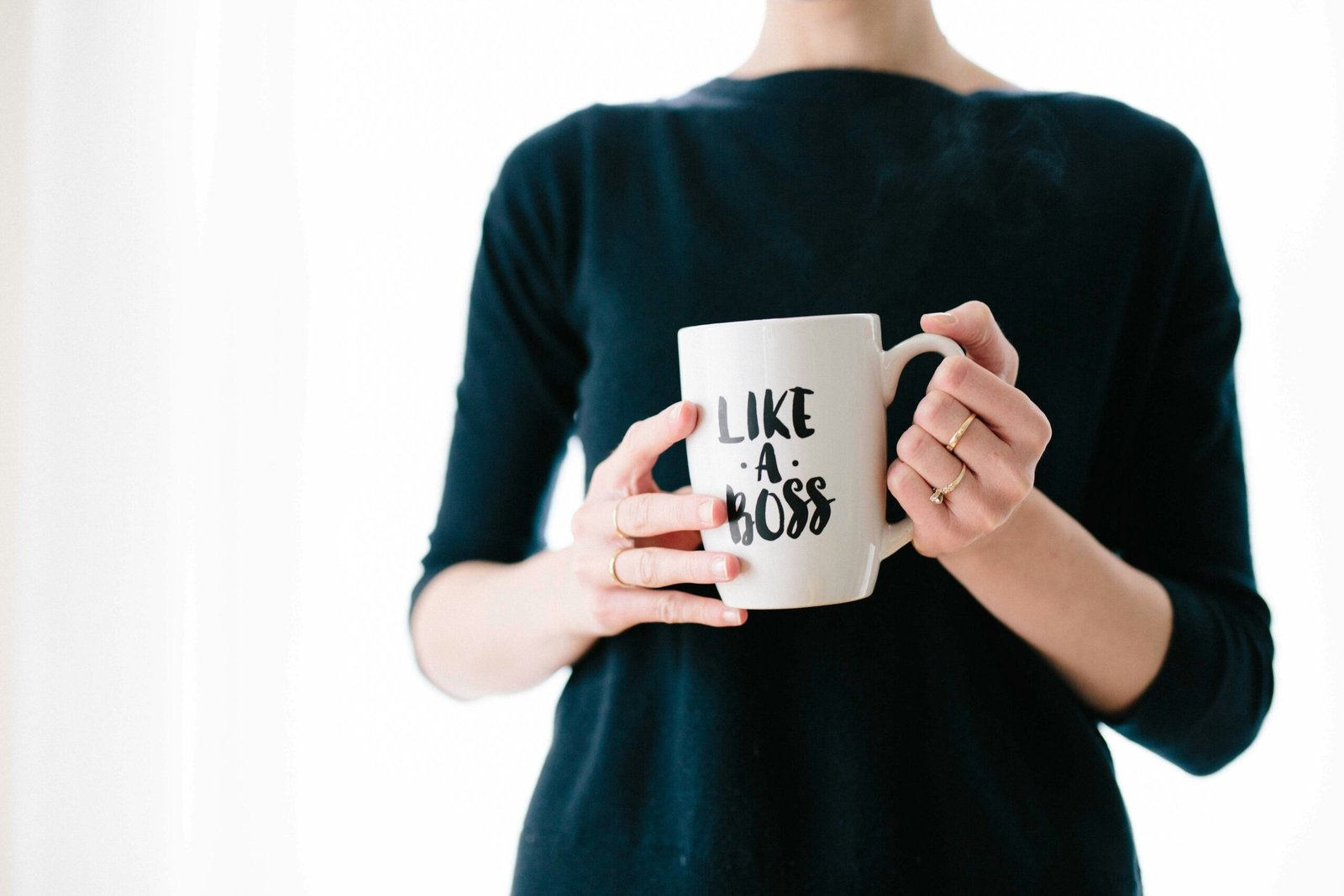 Re-entering the Workforce: Returning After a Career Break woman holding white mug while standing
